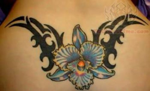 Blue Flower And Tribal Tattoo On Lower Back